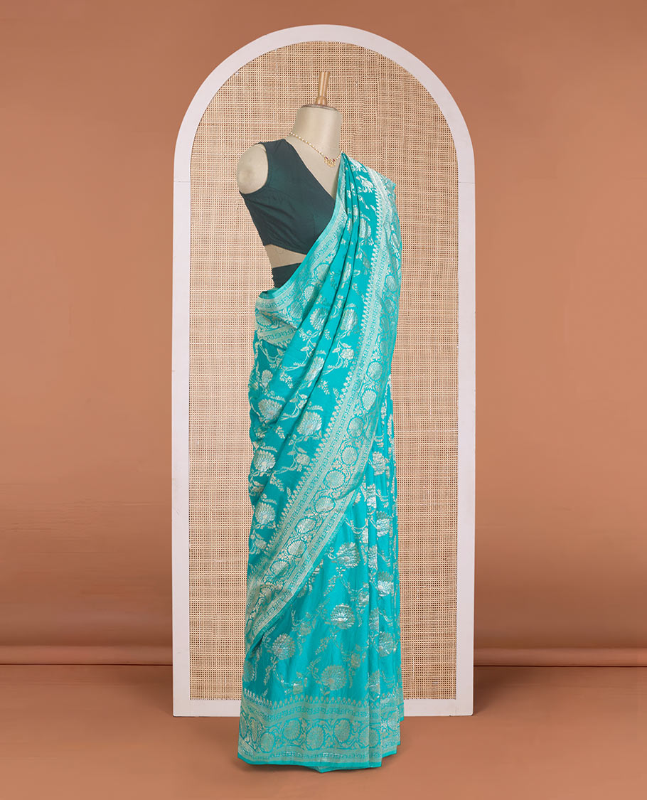 Green floral jaal jacquard fancy crepe saree, floral creeper zari border, and pallu of paisley jaal design