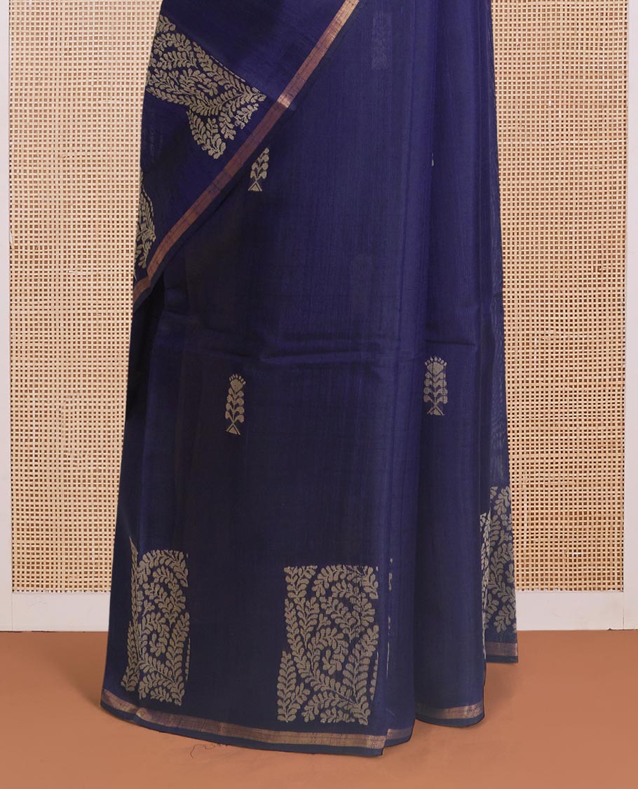 Navy blue dupion silk saree with floral buttas, thin zari piping border, and floral vine pallu