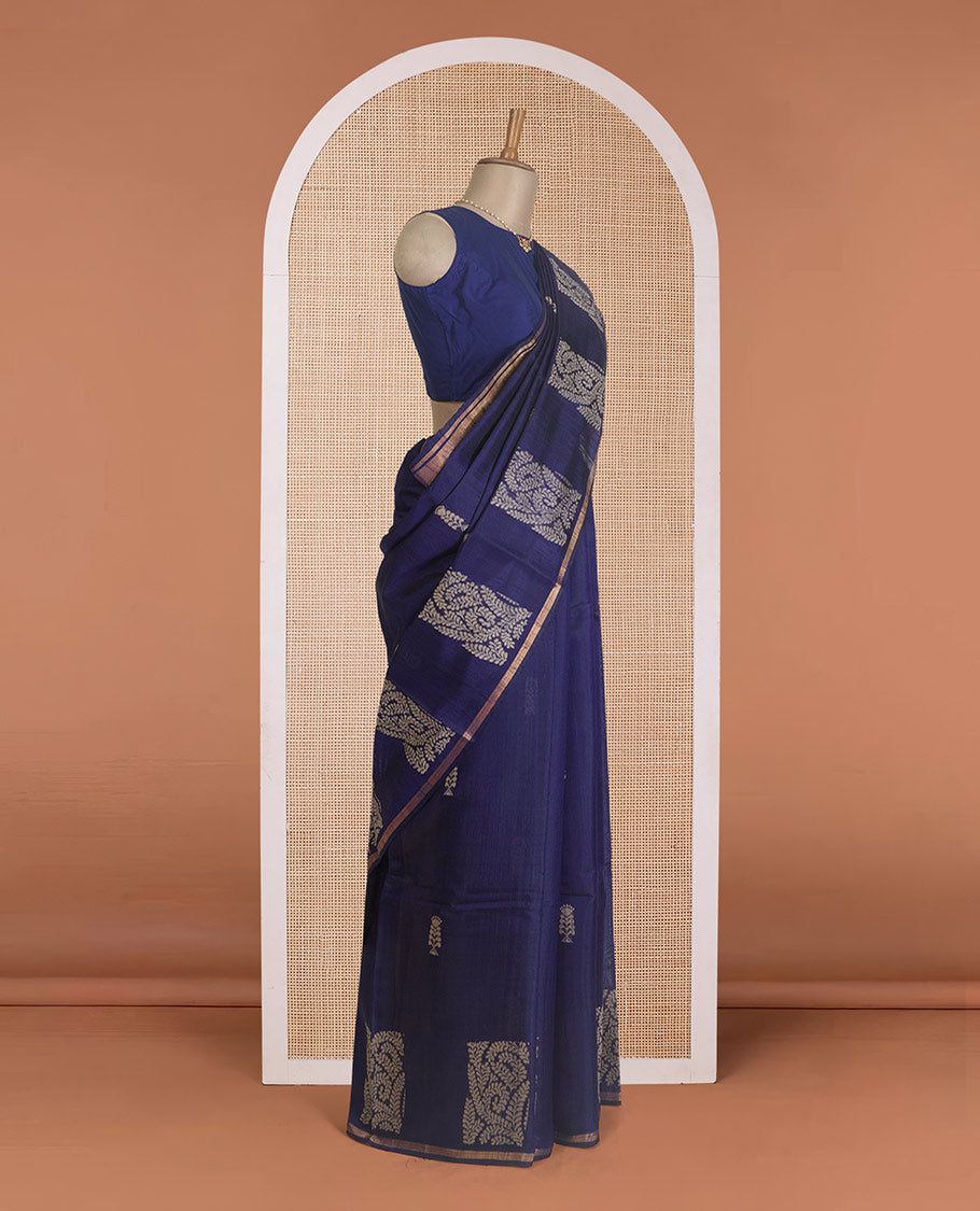 Navy blue dupion silk saree with floral buttas, thin zari piping border, and floral vine pallu