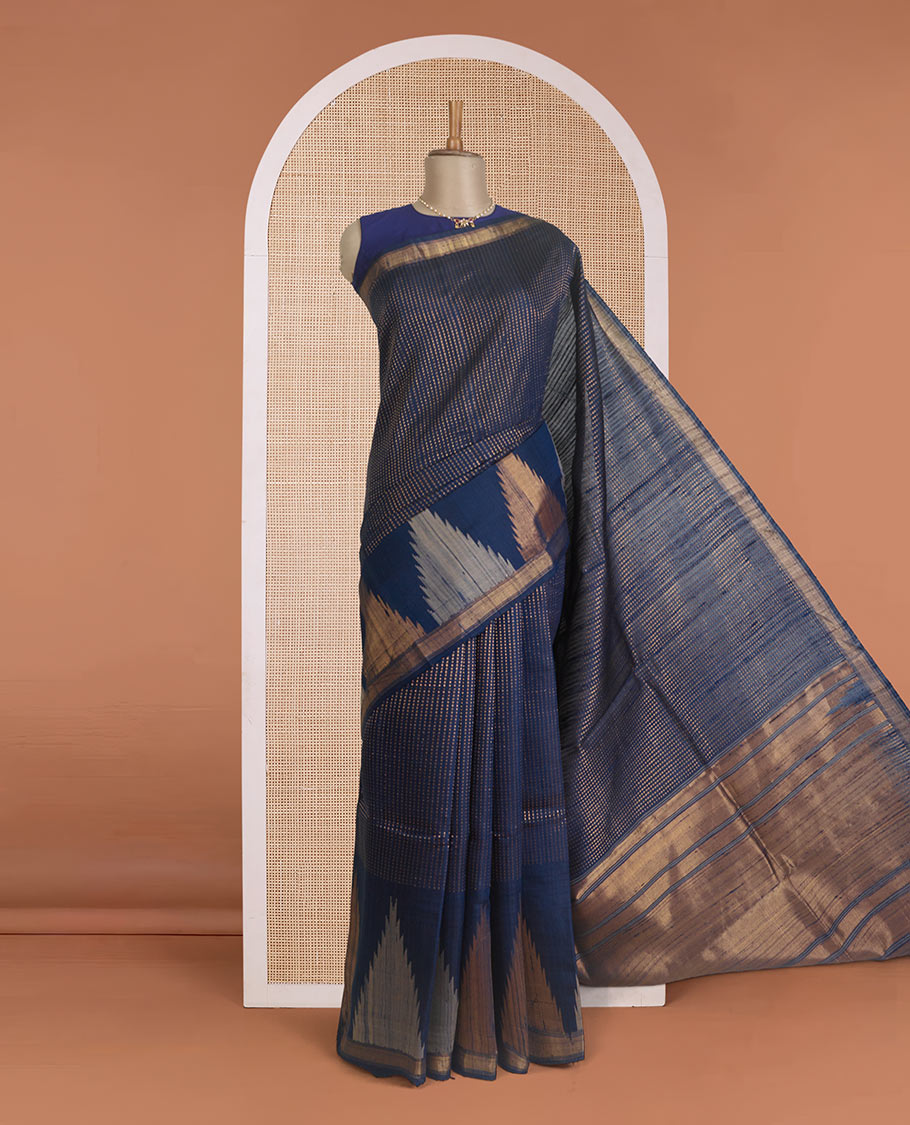 Blue dobby-style buttas dupion silk saree, big thazampoo rekku border, and zari-rich pallu