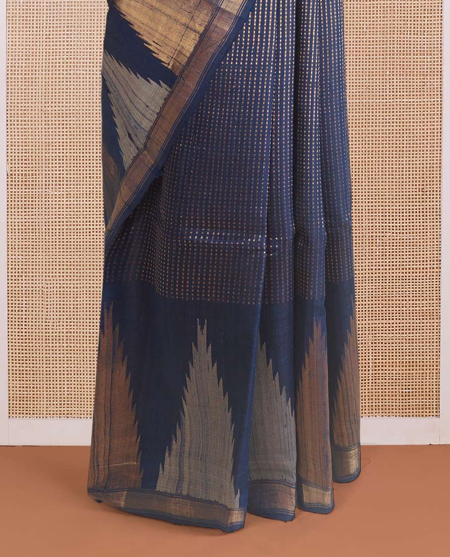 Blue dobby-style buttas dupion silk saree, big thazampoo rekku border, and zari-rich pallu