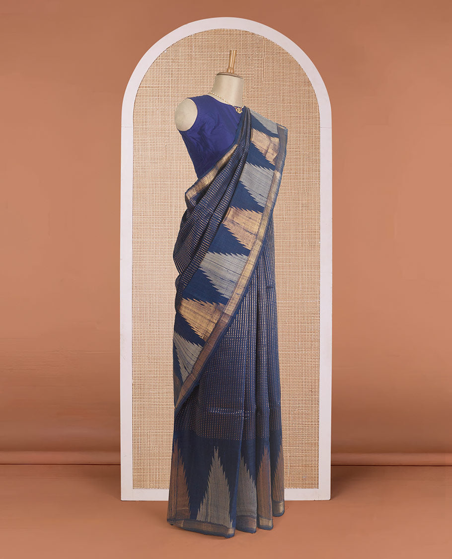 Blue dobby-style buttas dupion silk saree, big thazampoo rekku border, and zari-rich pallu