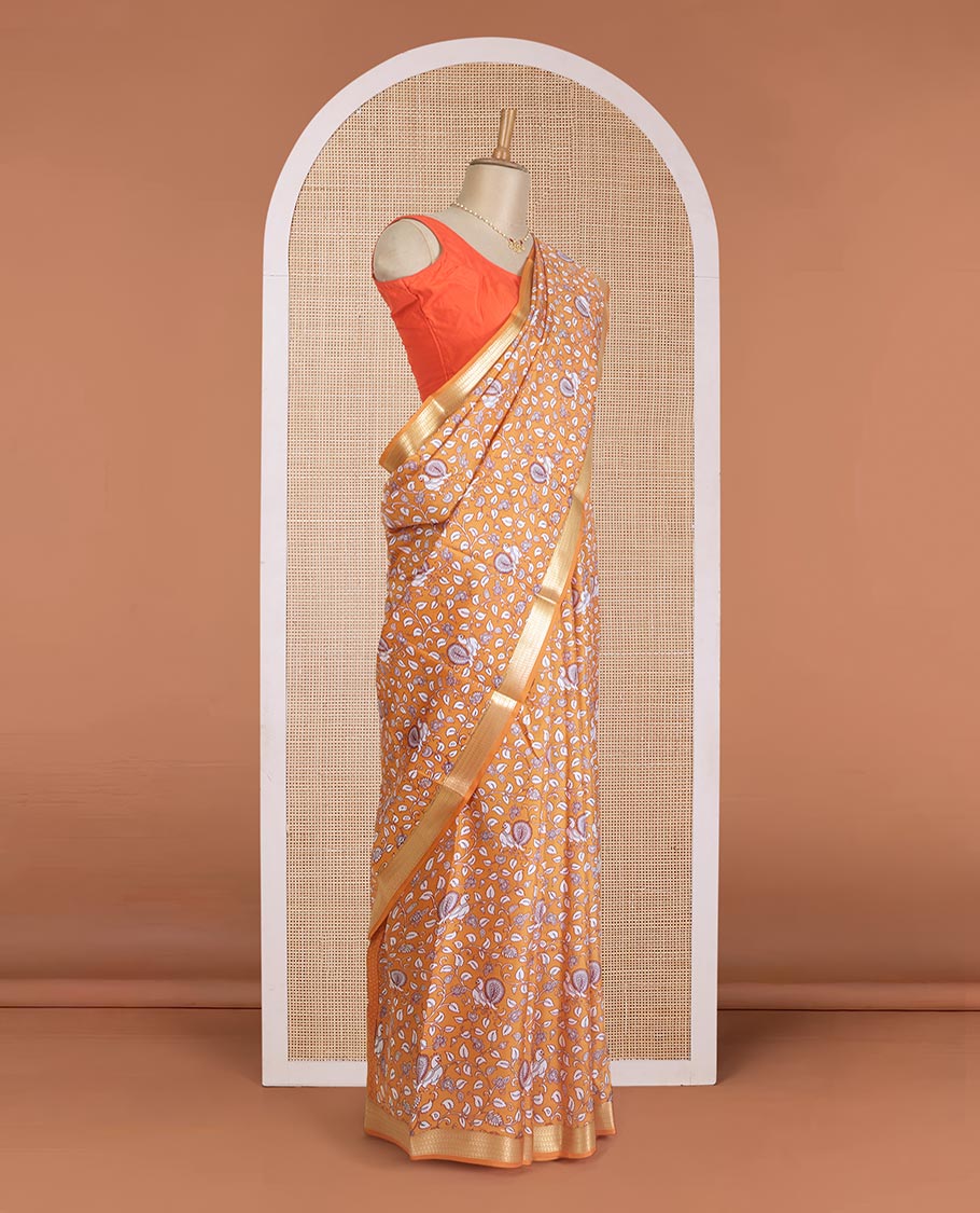 Orange kalamkari floral vine, and peacock printed silk saree, paisley zari motifs border, and striped pallu
