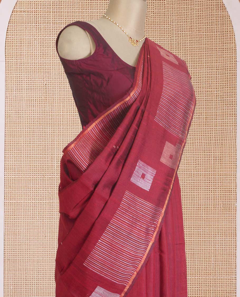 Maroon dupion silk saree with buttas, geometric patterned border, and zari rich pallu