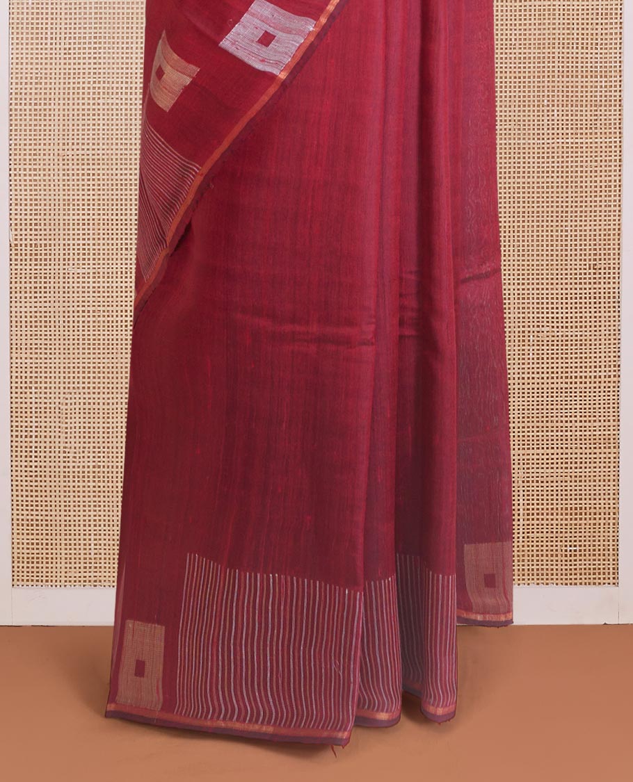 Maroon dupion silk saree with buttas, geometric patterned border, and zari rich pallu