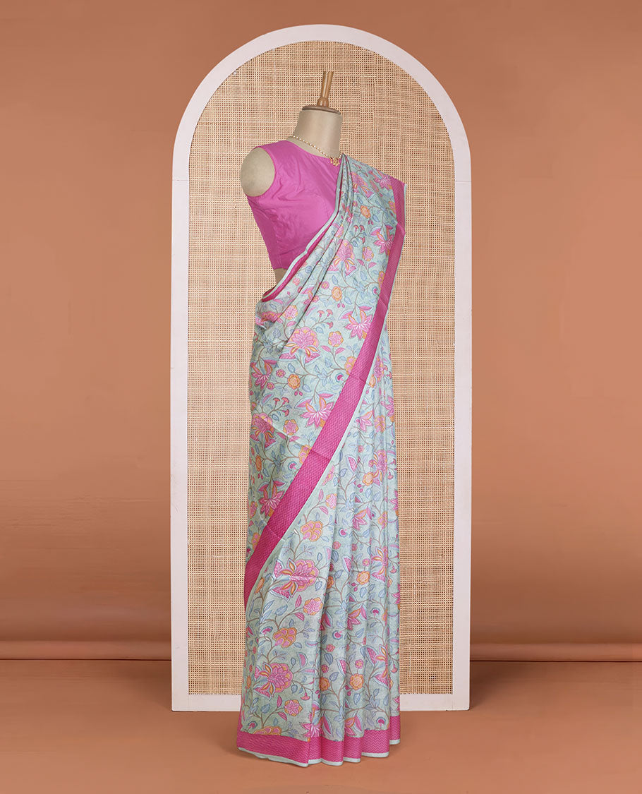 Pastel blue floral motifs printed silk saree, contrast chevron border, and chevron printed pallu