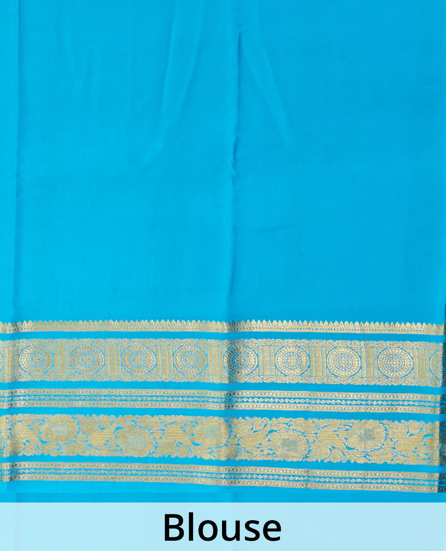 Blue zari buttas Mysore silk saree, zari border of chakram and floral creeper designs, and zari woven pallu