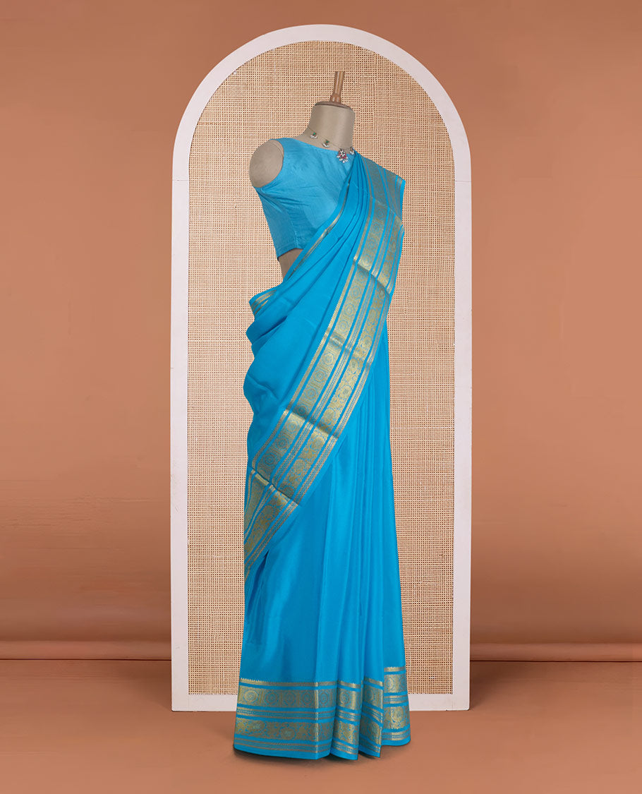 Blue zari buttas Mysore silk saree, zari border of chakram and floral creeper designs, and zari woven pallu