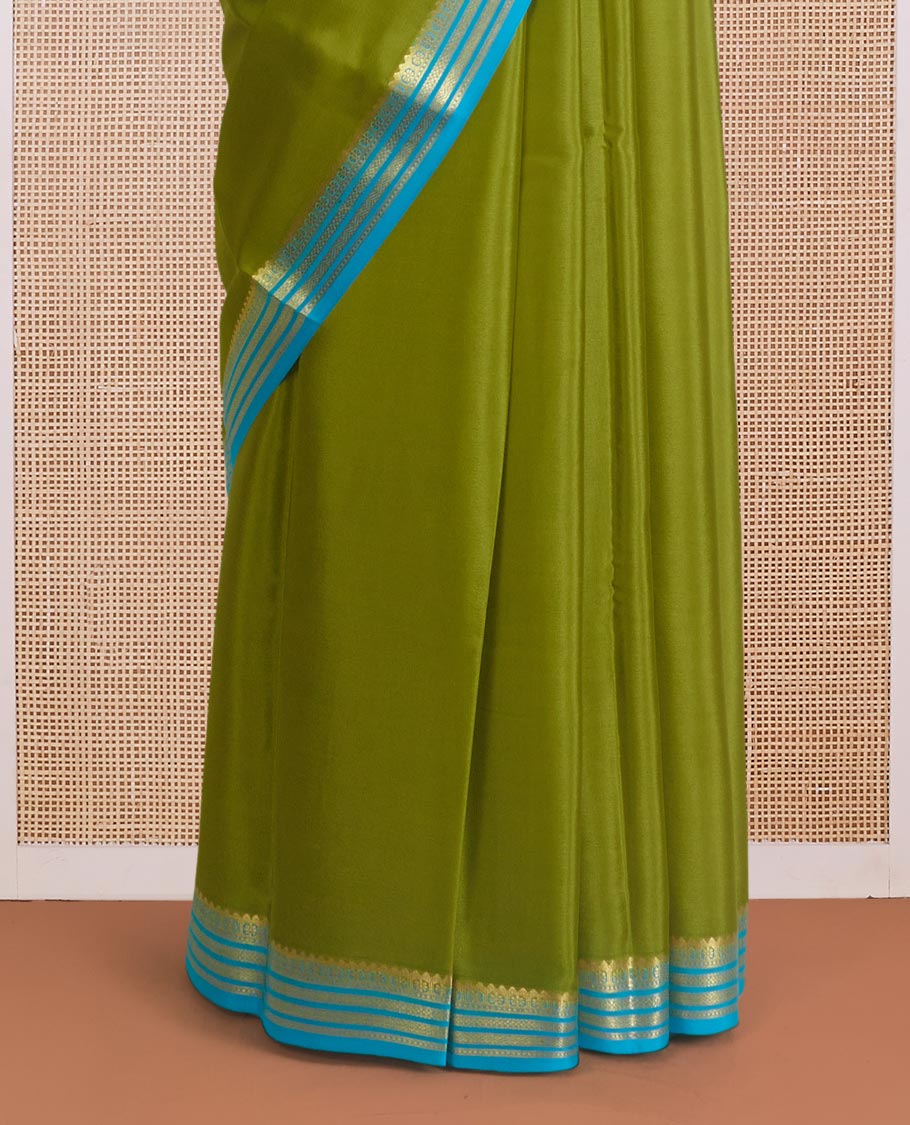 Parrot green plain Mysore silk saree, contrast traditional zari design border, and zari striped pallu