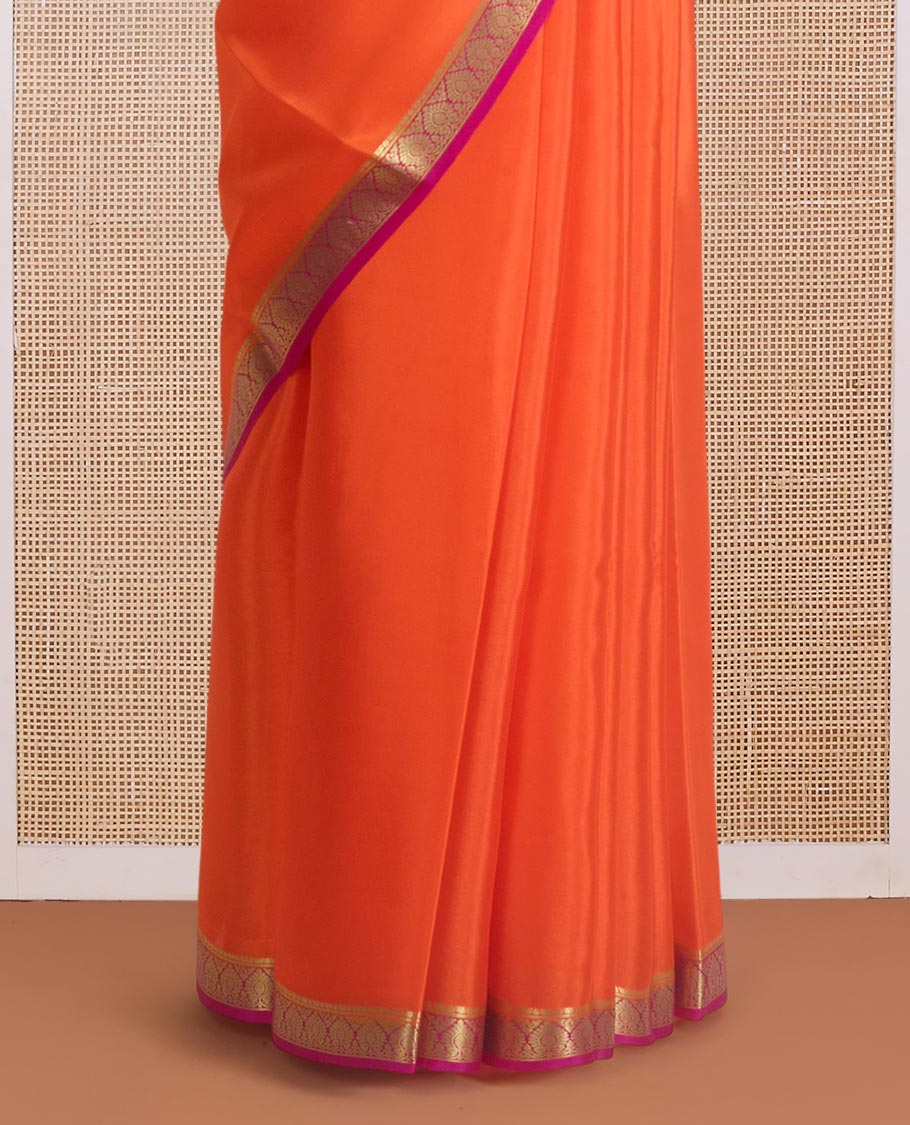 Jalebi orange plain Mysore silk saree, contrast Mughal style zari border, and zari striped pallu