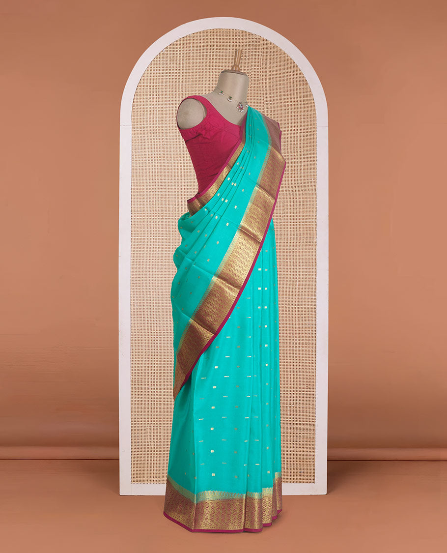 Green zari buttas Mysore silk saree, contrast floral design border, and pallu of jaal design