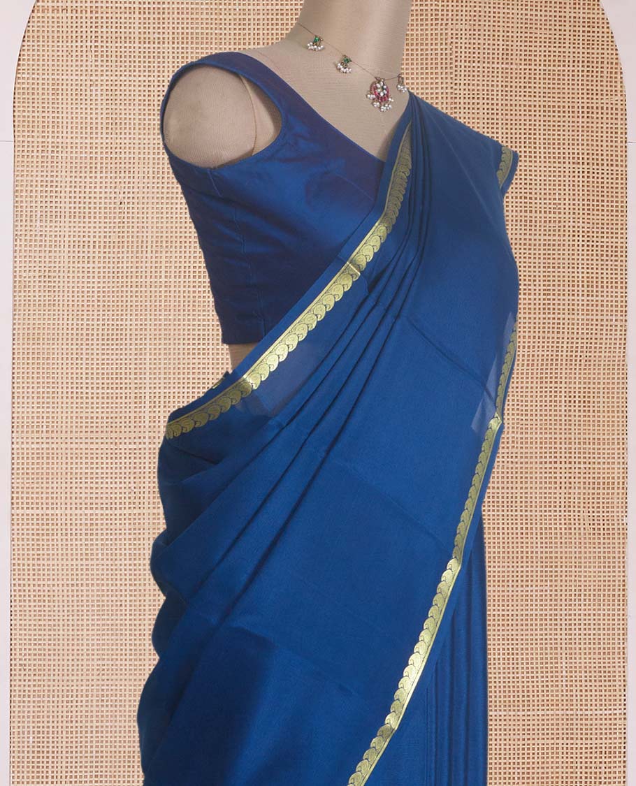Navy blue plain Mysore silk saree, zari border of paisleys, and zari striped pallu