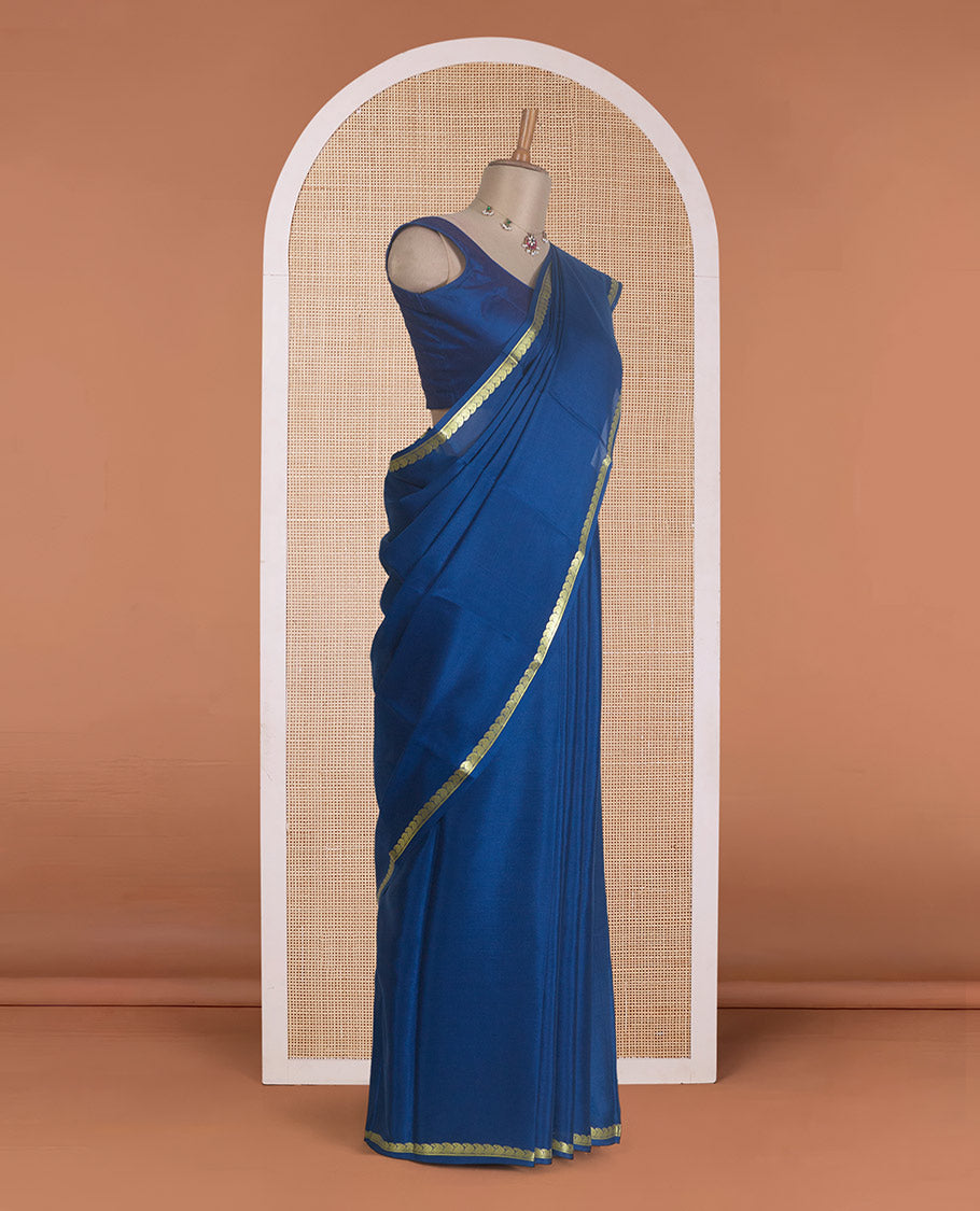 Navy blue plain Mysore silk saree, zari border of paisleys, and zari striped pallu