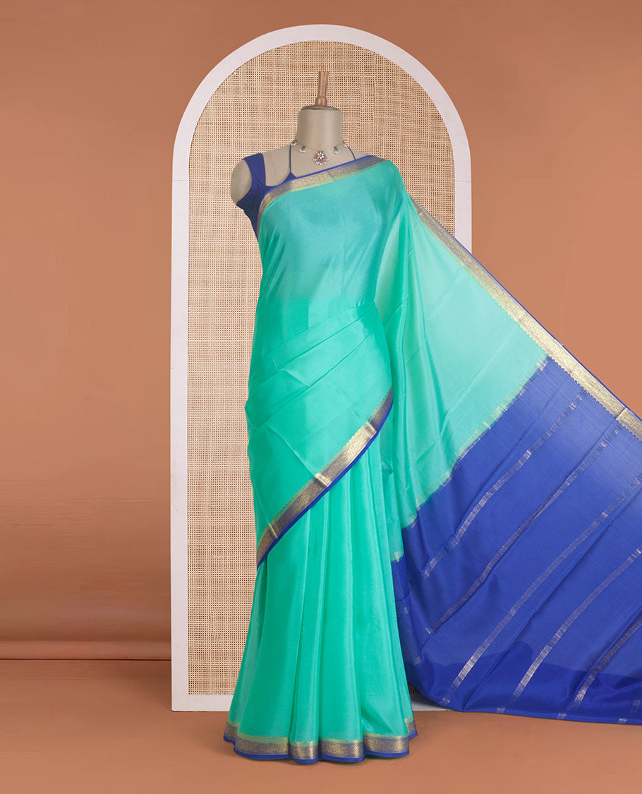 Seafoam green plain Mysore silk saree, contrast traditional zari border, and zari striped pallu