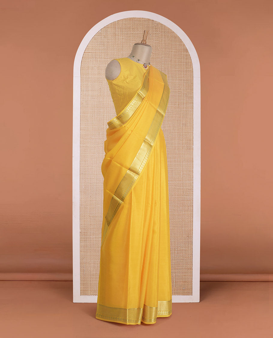 Yellow plain Mysore silk saree, traditional zari design steeped border, and zari striped pallu
