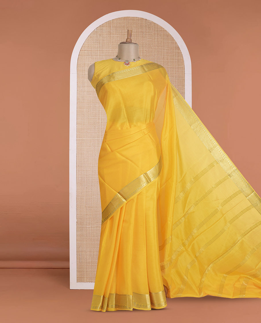 Yellow plain Mysore silk saree, traditional zari design steeped border, and zari striped pallu