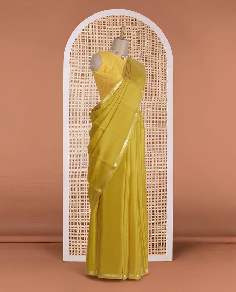 Yellow plain Mysore silk saree, traditional zari border, and zari striped pallu