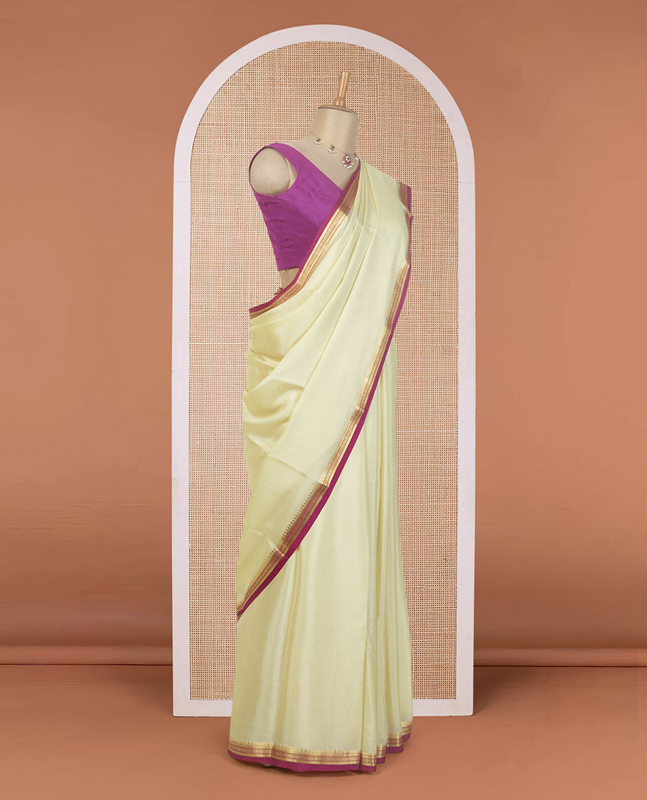 Cream plain Mysore silk saree, contrast temple traditional zari border, and zari striped pallu