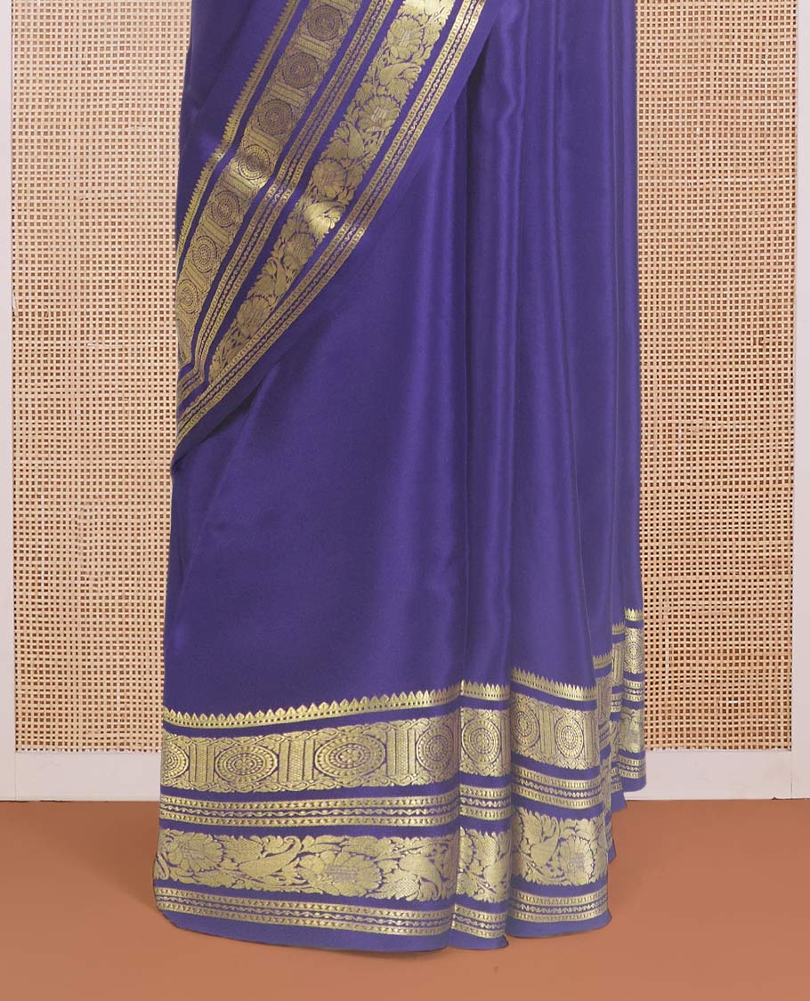 Navy blue plain Mysore silk saree, traditional zari design steeped border, and zari striped pallu