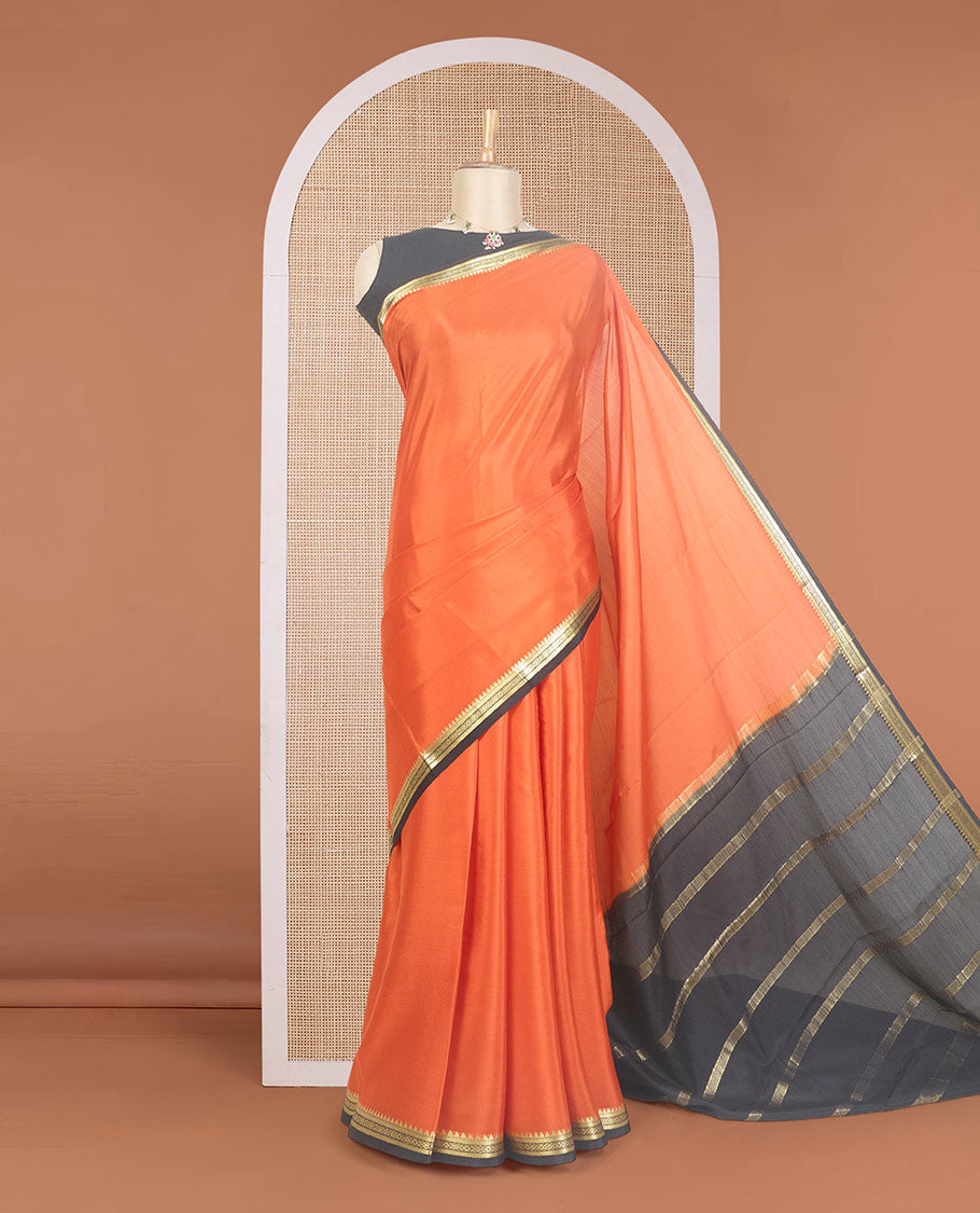 Orange plain Mysore silk saree, contrast traditional zari design border, and zari striped pallu