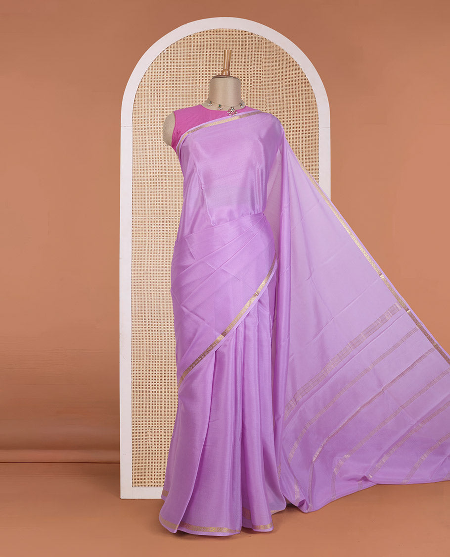 Violet plain Mysore silk saree, floral creeper zari border, and zari striped pallu