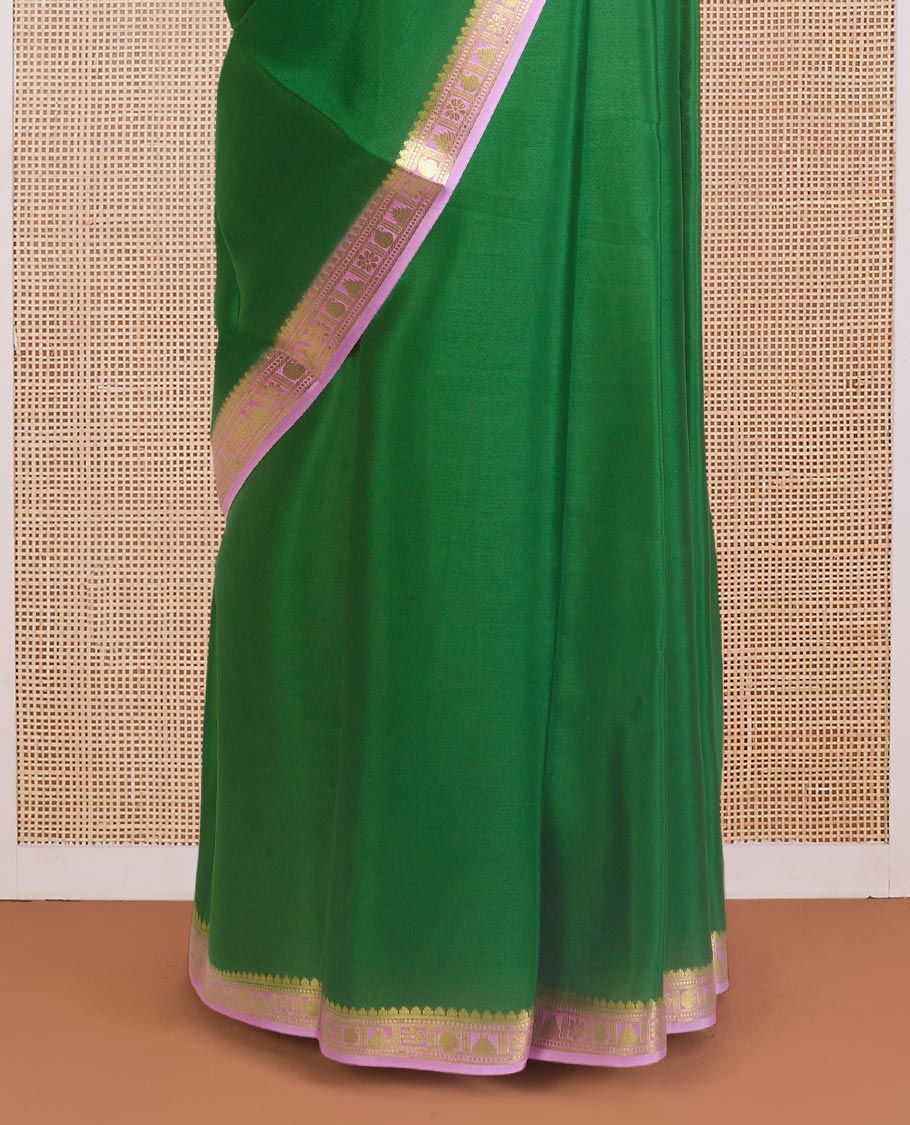 Green plain Mysore silk saree, contrast traditional zari design border, and zari striped pallu