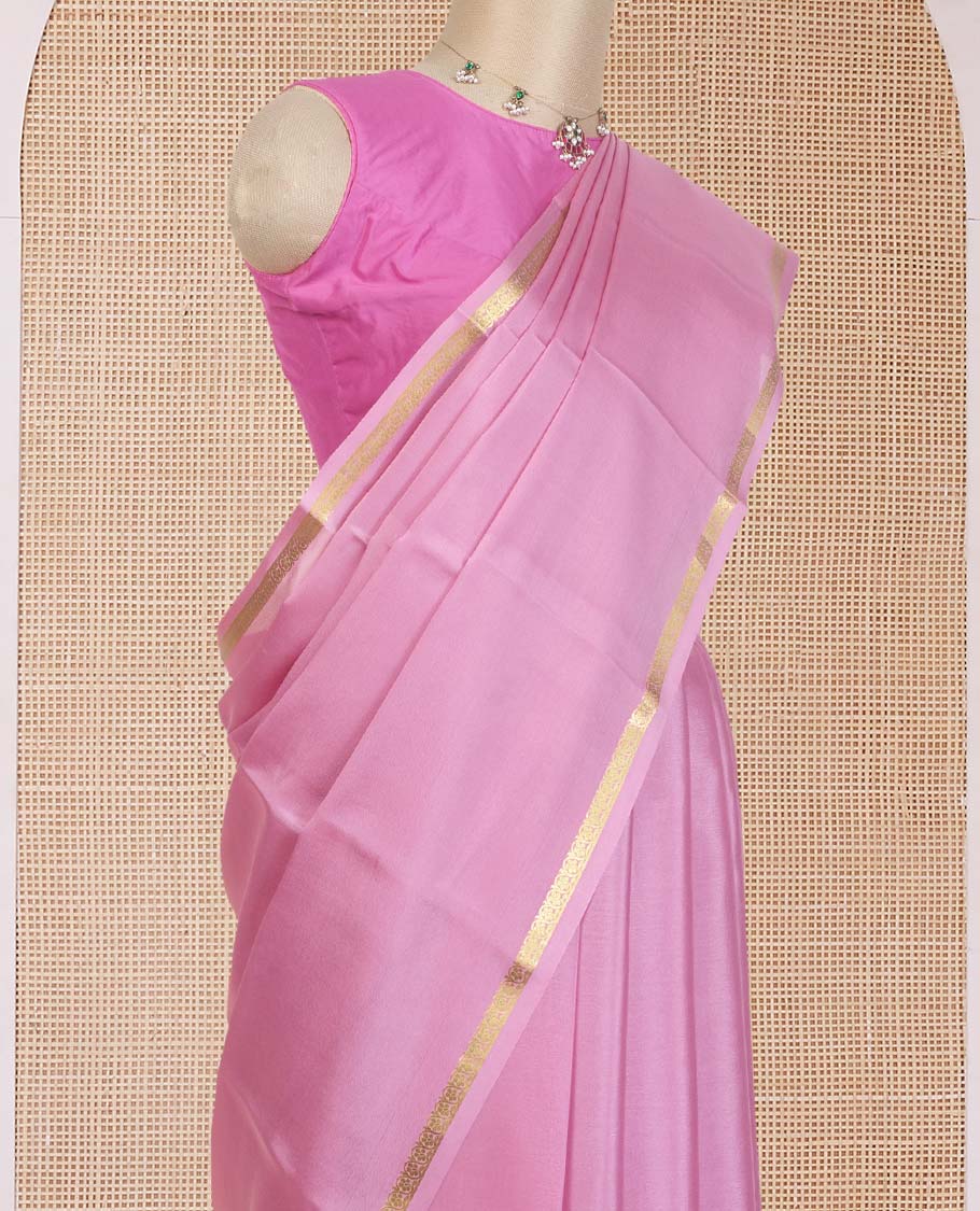 Flamingo pink plain Mysore silk saree, floral creeper zari border, and zari striped pallu