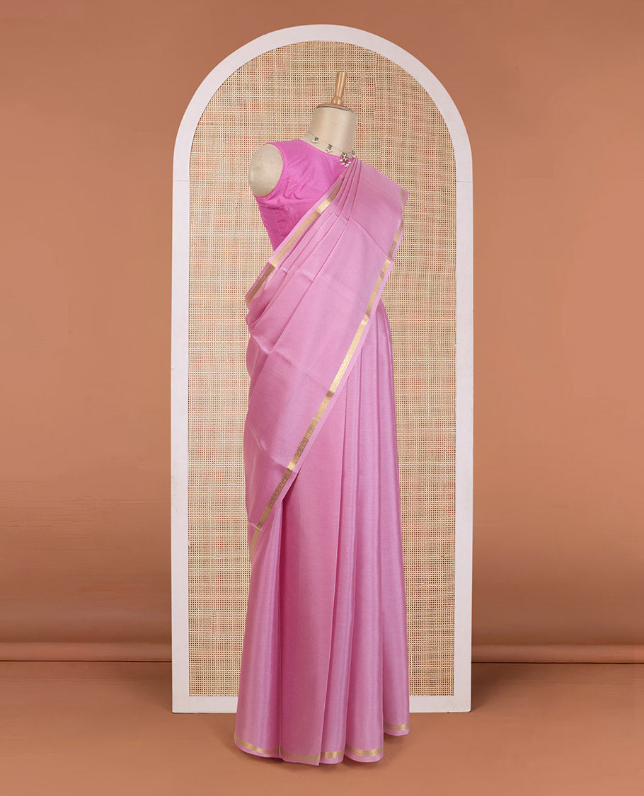 Flamingo pink plain Mysore silk saree, floral creeper zari border, and zari striped pallu