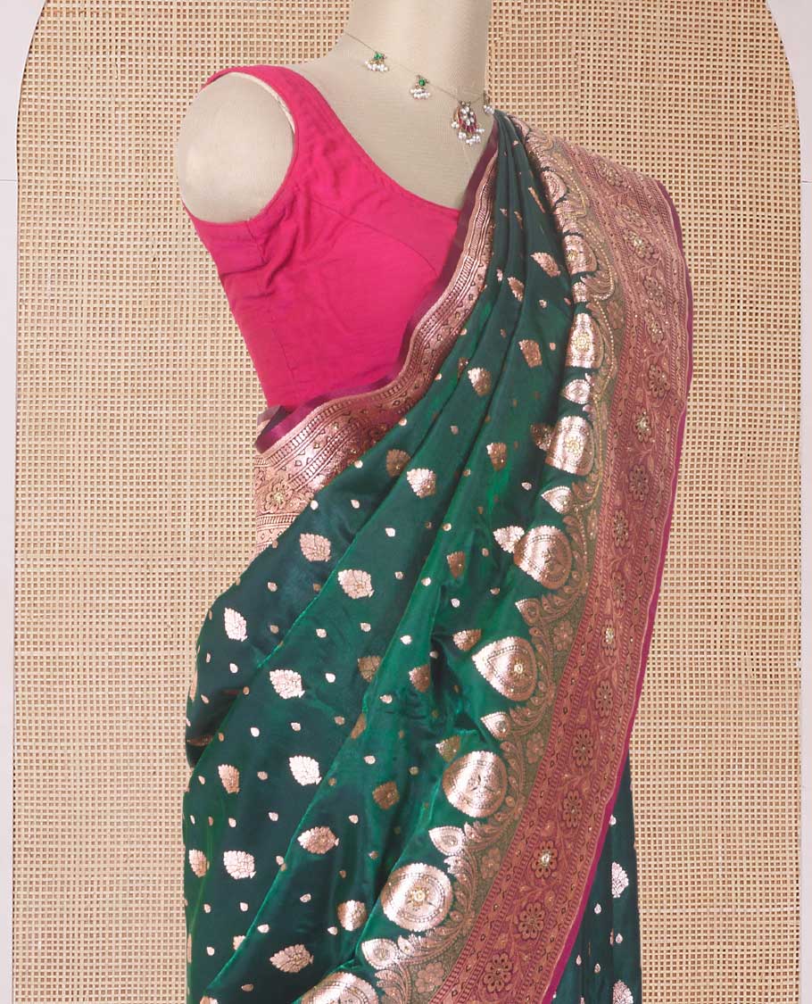 Dark green zari buttas with micro stonework banaras nylon silk saree, contrast floral creeper zari and stone work border, and zari woven jaal pallu