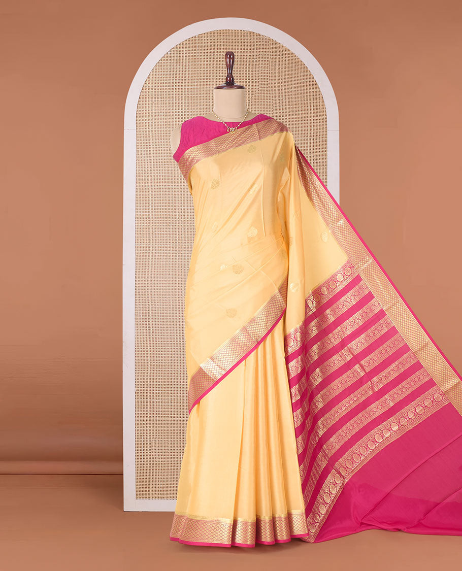 Yellow zari buttas Mysore silk saree, contrast jaal zari border, and pallu of floral creeper design in zari