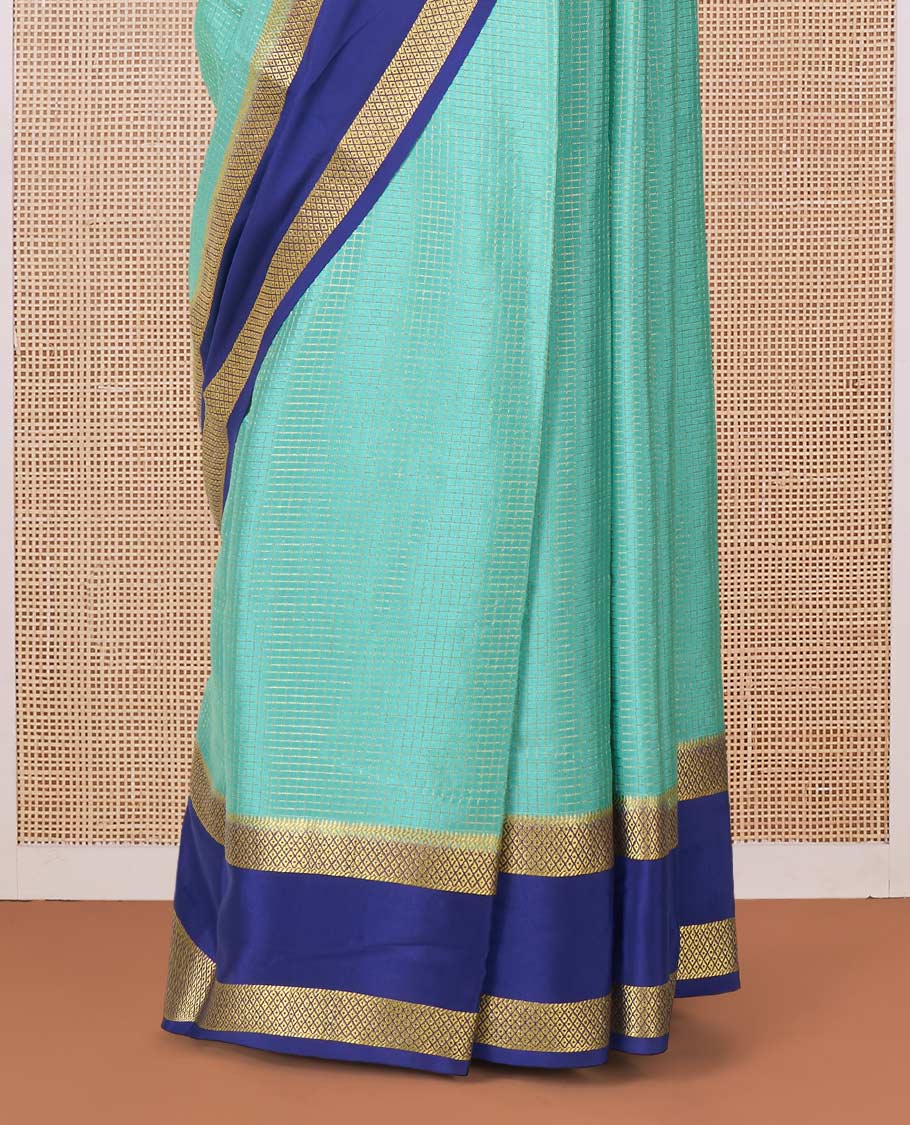 Green zari checked Mysore silk saree, contrast rettai pettu peacock eye zari border, and pallu of zari stripes