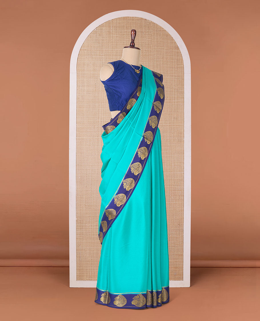 Green plain Mysore silk saree, contrast paisley motifs zari woven border, and pallu of zari stripes