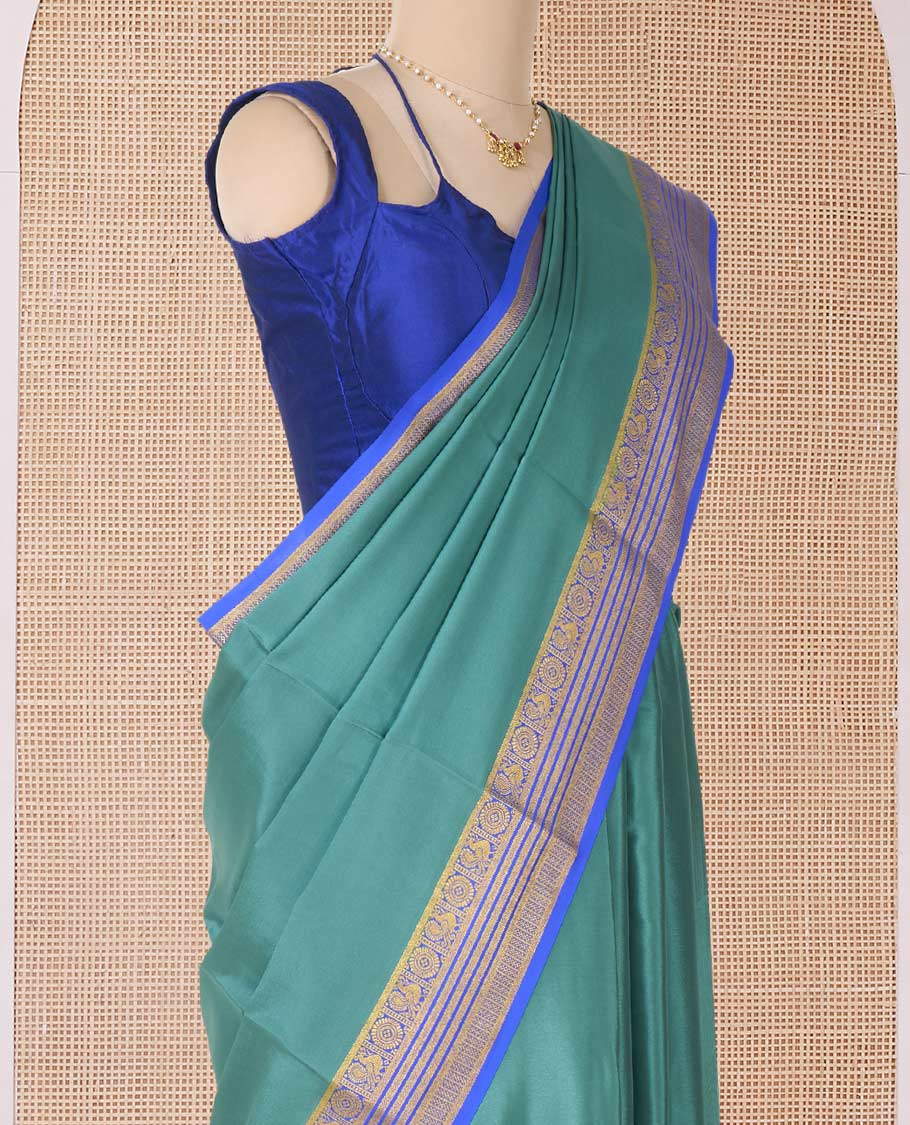 Green plain Mysore silk saree, contrast traditional zari border of Peacock and chakram and pallu of traditional designs