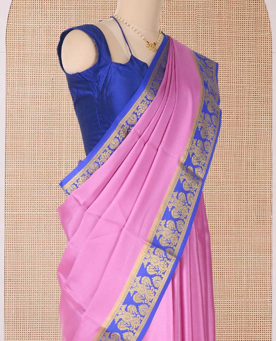 Purple plain Mysore silk saree, contrast two-headed eagle border, and pallu of traditional designs
