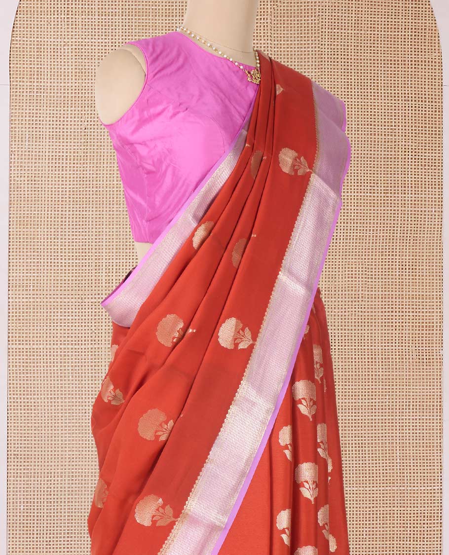 Orange floral buttas Mysore silk saree, contrast traditional zari border, and pallu of jaal design