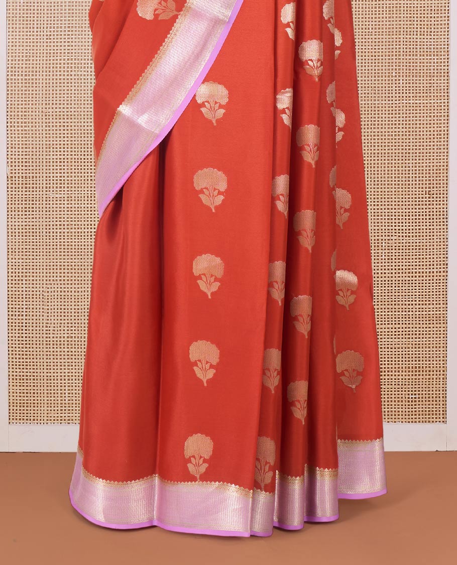 Orange floral buttas Mysore silk saree, contrast traditional zari border, and pallu of jaal design