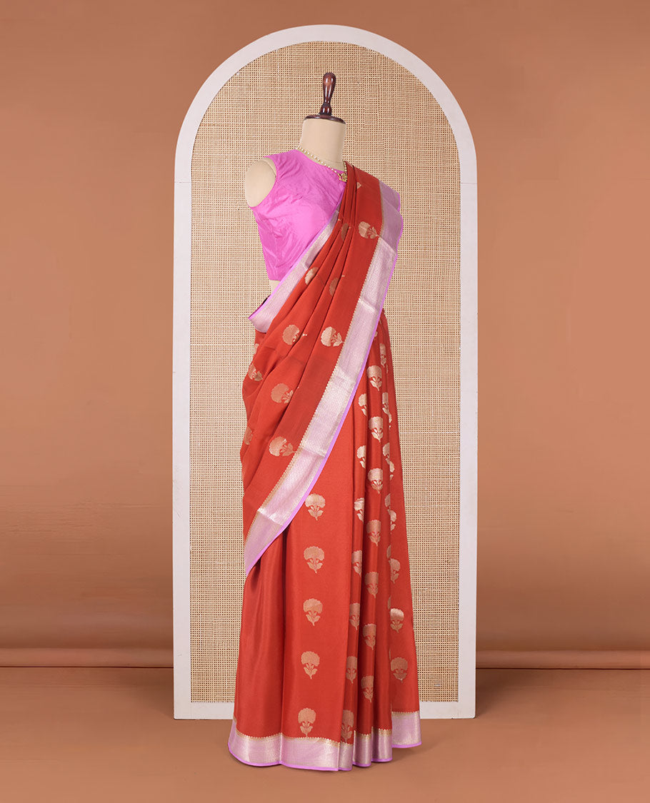 Orange floral buttas Mysore silk saree, contrast traditional zari border, and pallu of jaal design