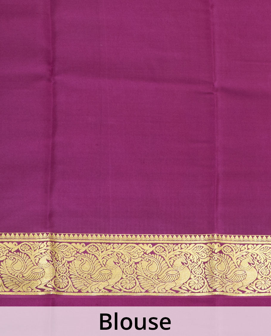 Purple plain Mysore silk saree, traditional zari border of peacocks, and pallu of traditional designs