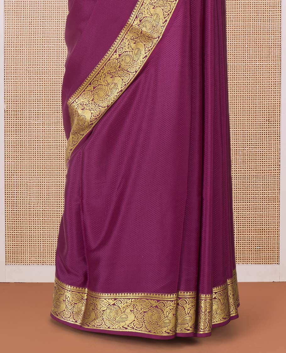 Purple plain Mysore silk saree, traditional zari border of peacocks, and pallu of traditional designs