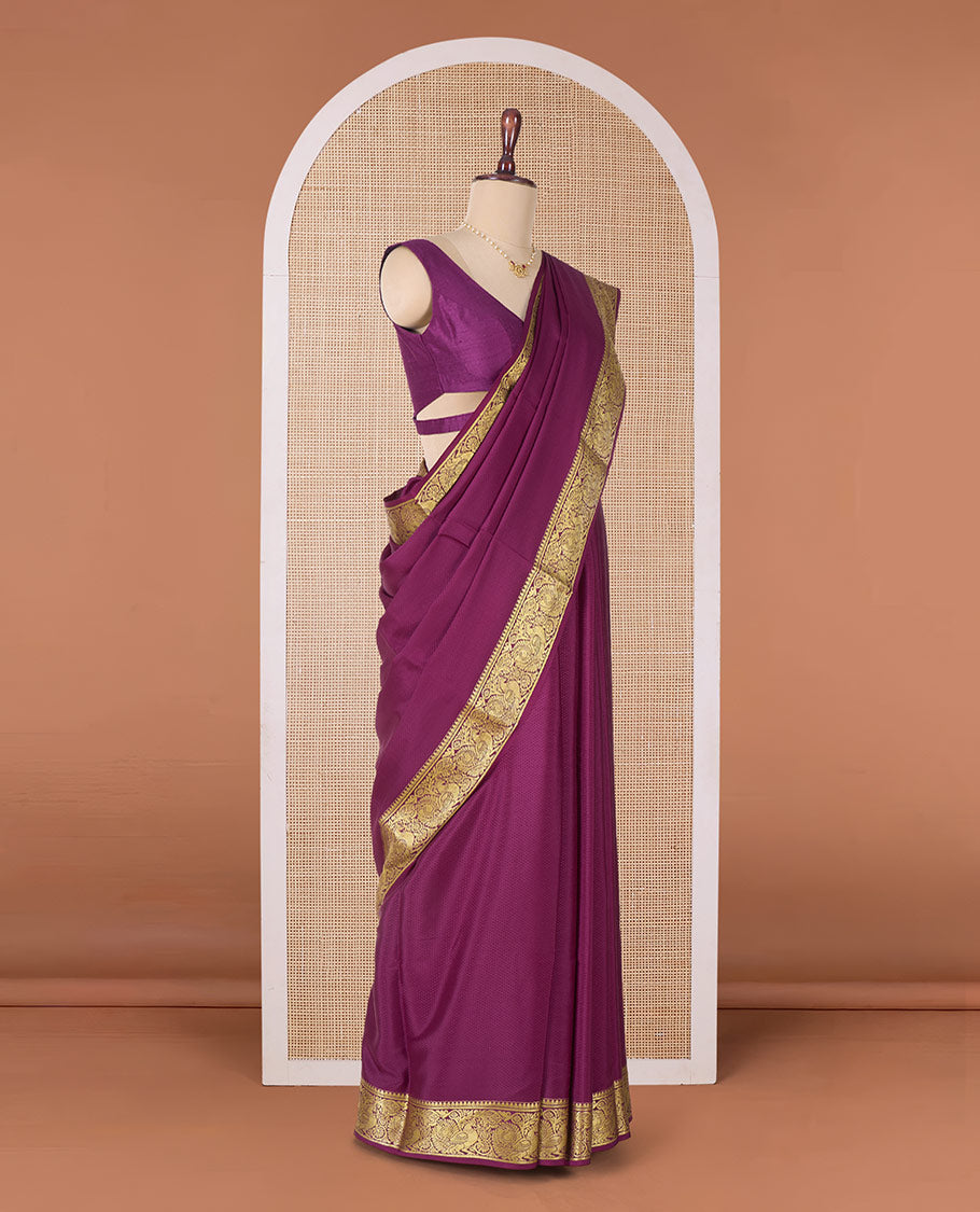 Purple plain Mysore silk saree, traditional zari border of peacocks, and pallu of traditional designs