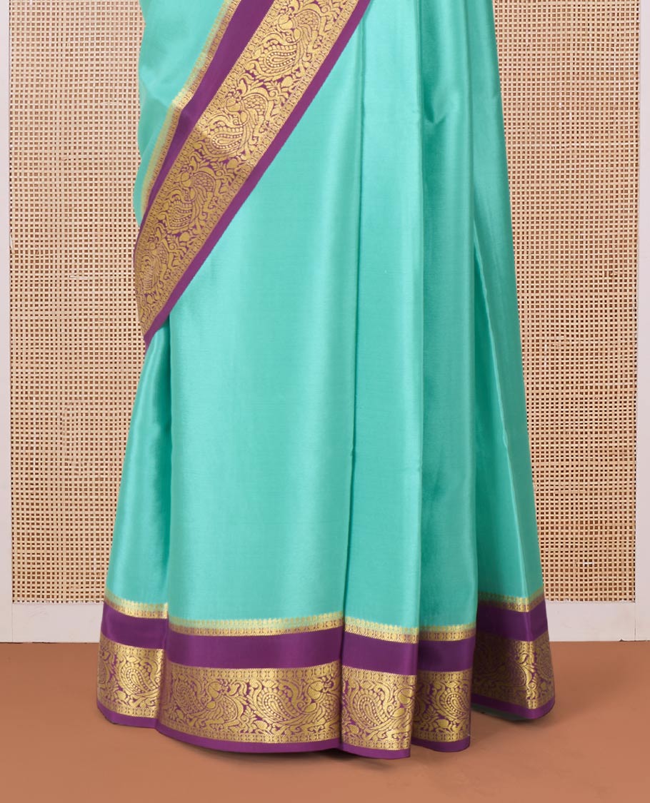 Green plain Mysore silk saree, contrast traditional zari rettai pettu border, and pallu of jaal design