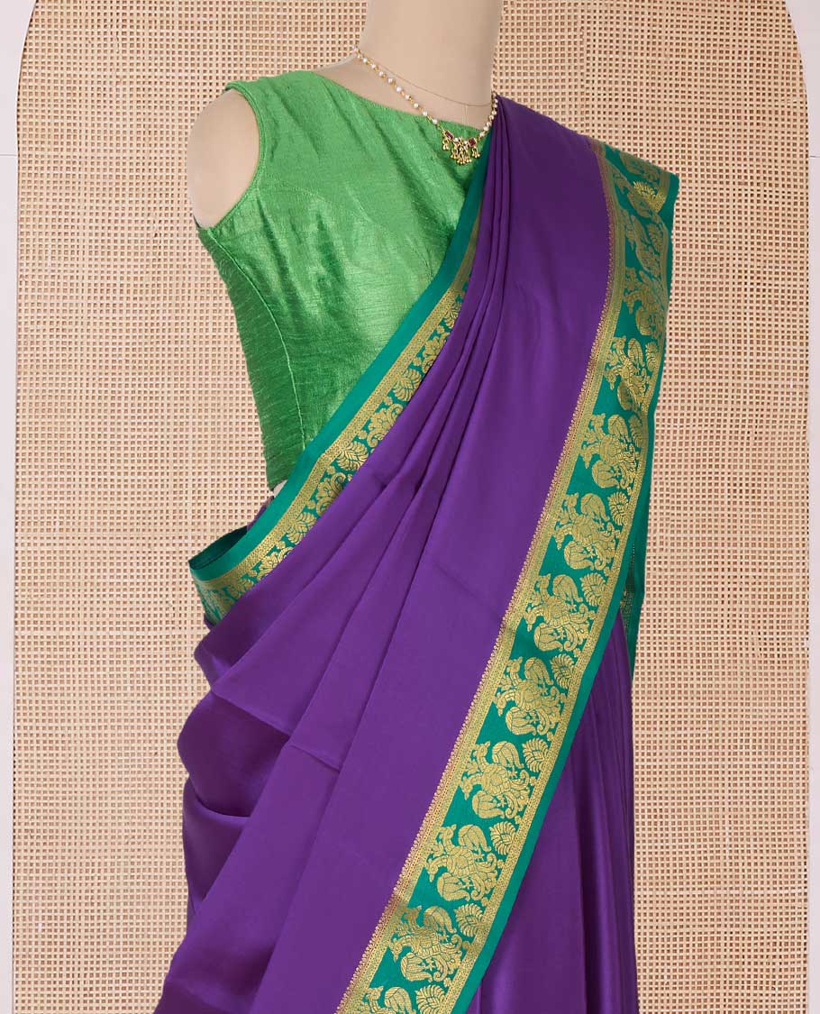 Purple plain Mysore silk saree, contrast two-headed eagle border, and pallu of traditional designs