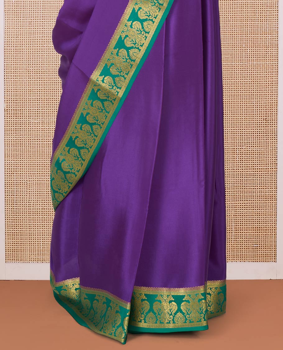 Purple plain Mysore silk saree, contrast two-headed eagle border, and pallu of traditional designs