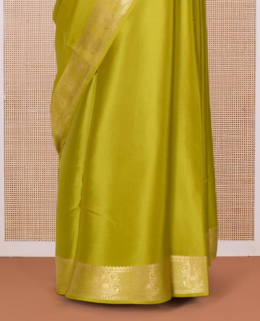 Green plain Mysore silk saree, zari border of two-headed eagle motifs, and pallu of zari designs