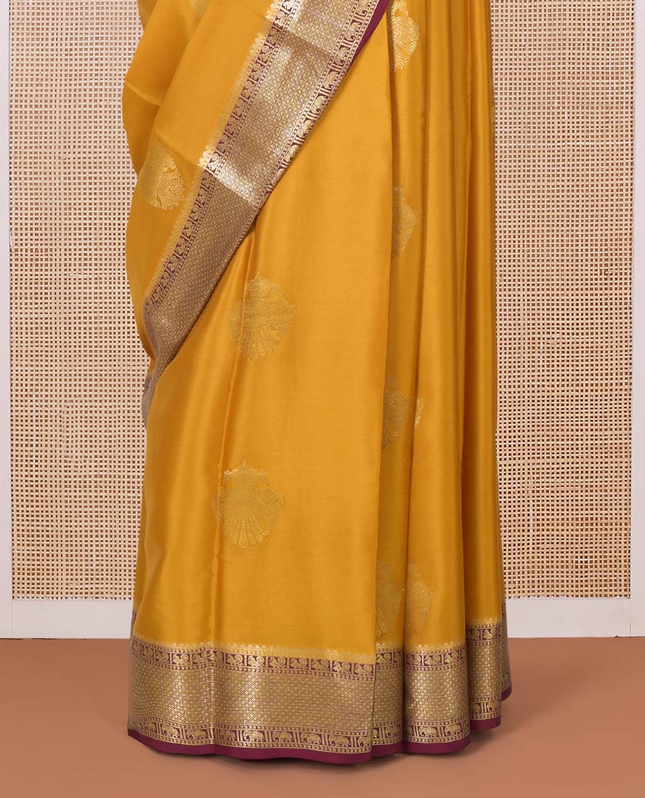Yellow two-headed eagle motifs zari woven Mysore silk saree, contrast traditional zari border, and pallu of thick zari designs