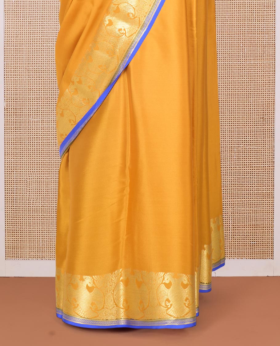 Yellow plain Mysore silk saree, two-headed eagle zari border, and pallu steeped with two-headed eagle motifs
