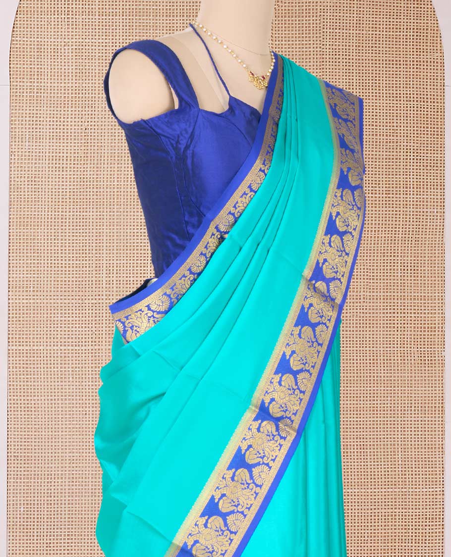 Green plain Mysore silk saree, contrast two-headed eagle border, and pallu of traditional designs