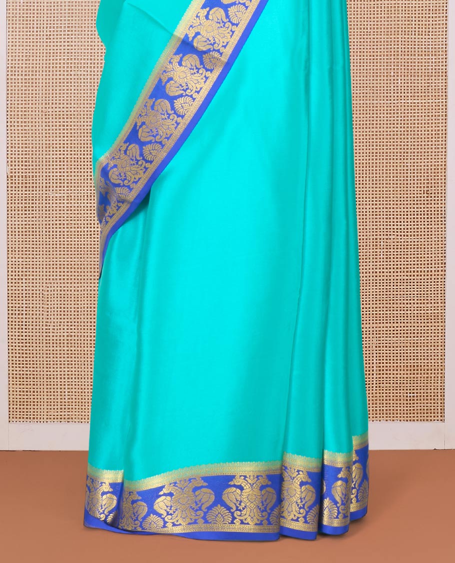 Green plain Mysore silk saree, contrast two-headed eagle border, and pallu of traditional designs
