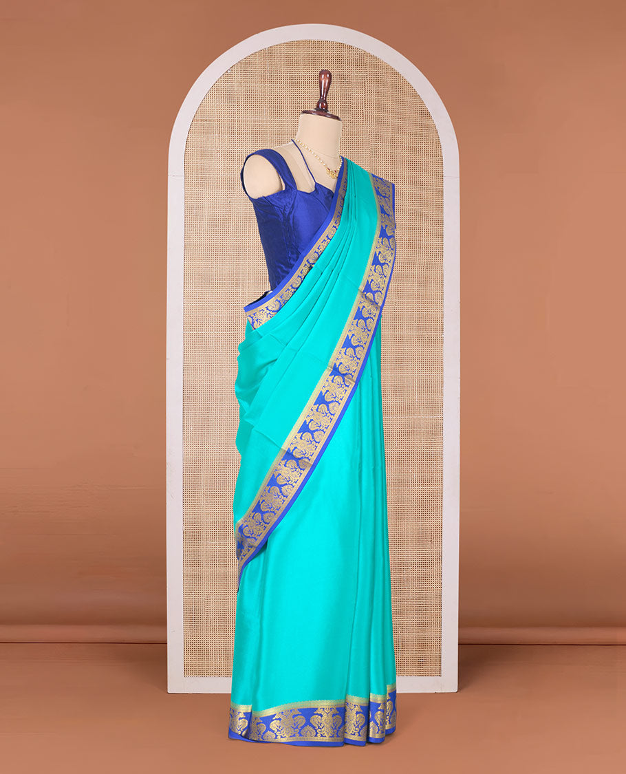 Green plain Mysore silk saree, contrast two-headed eagle border, and pallu of traditional designs