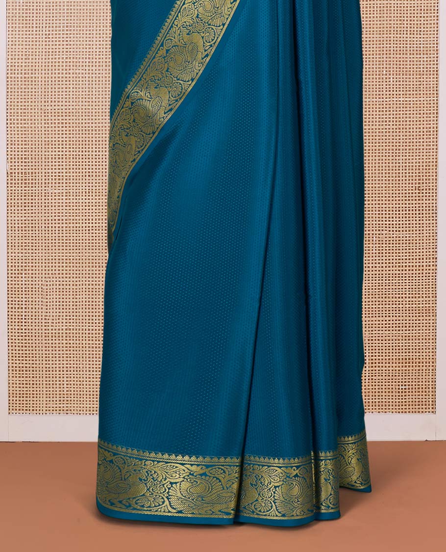 Peacock color embossed Mysore silk saree, traditional peacock motifs zari woven border, and pallu of traditional designs